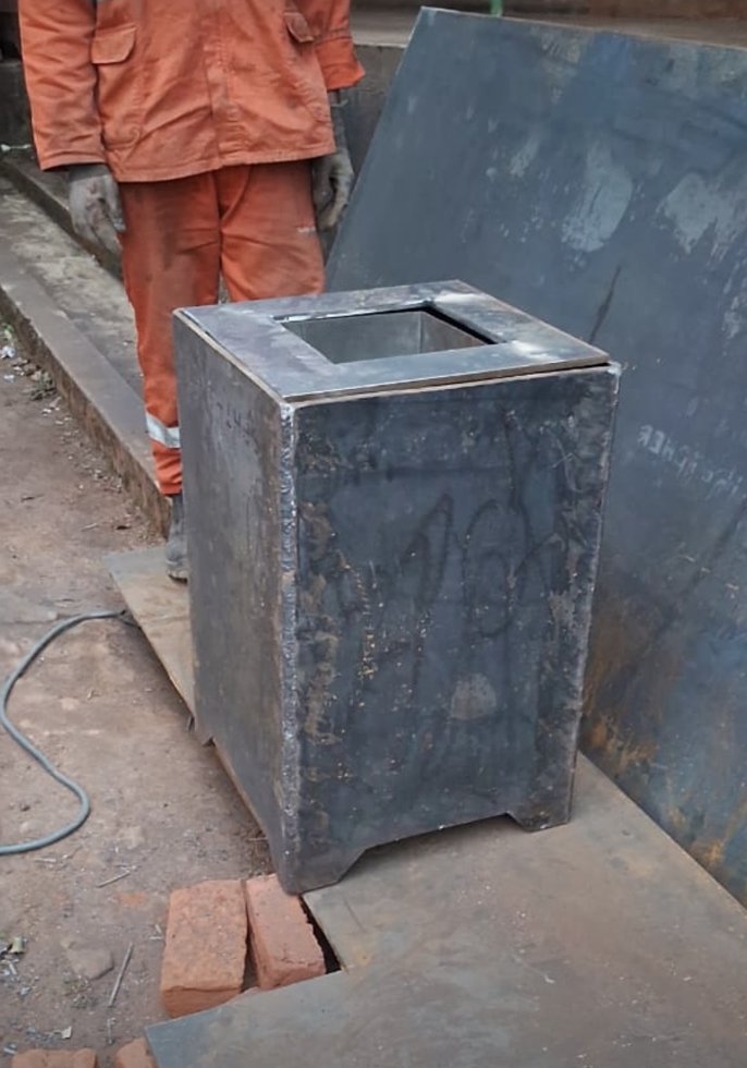 The first cooker’s welded steel casing standing upright, with its top opening